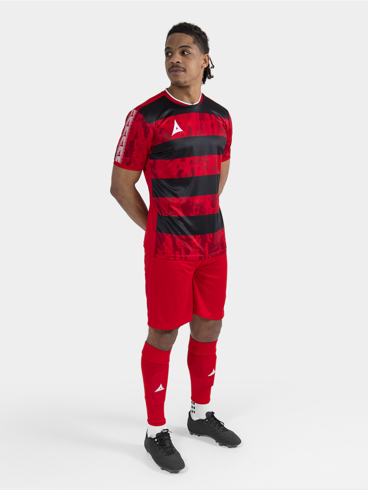 	full-length view of the red and black pro intent kit, demonstrating a unified teamwear look.