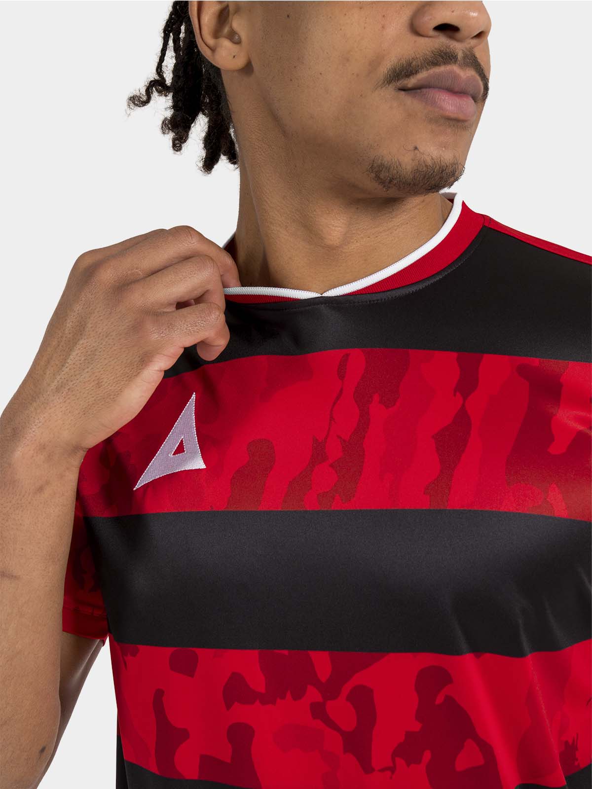 	interior neck detail of the red and black jersey, featuring the soft-feel label and durable ribbed neckline.
