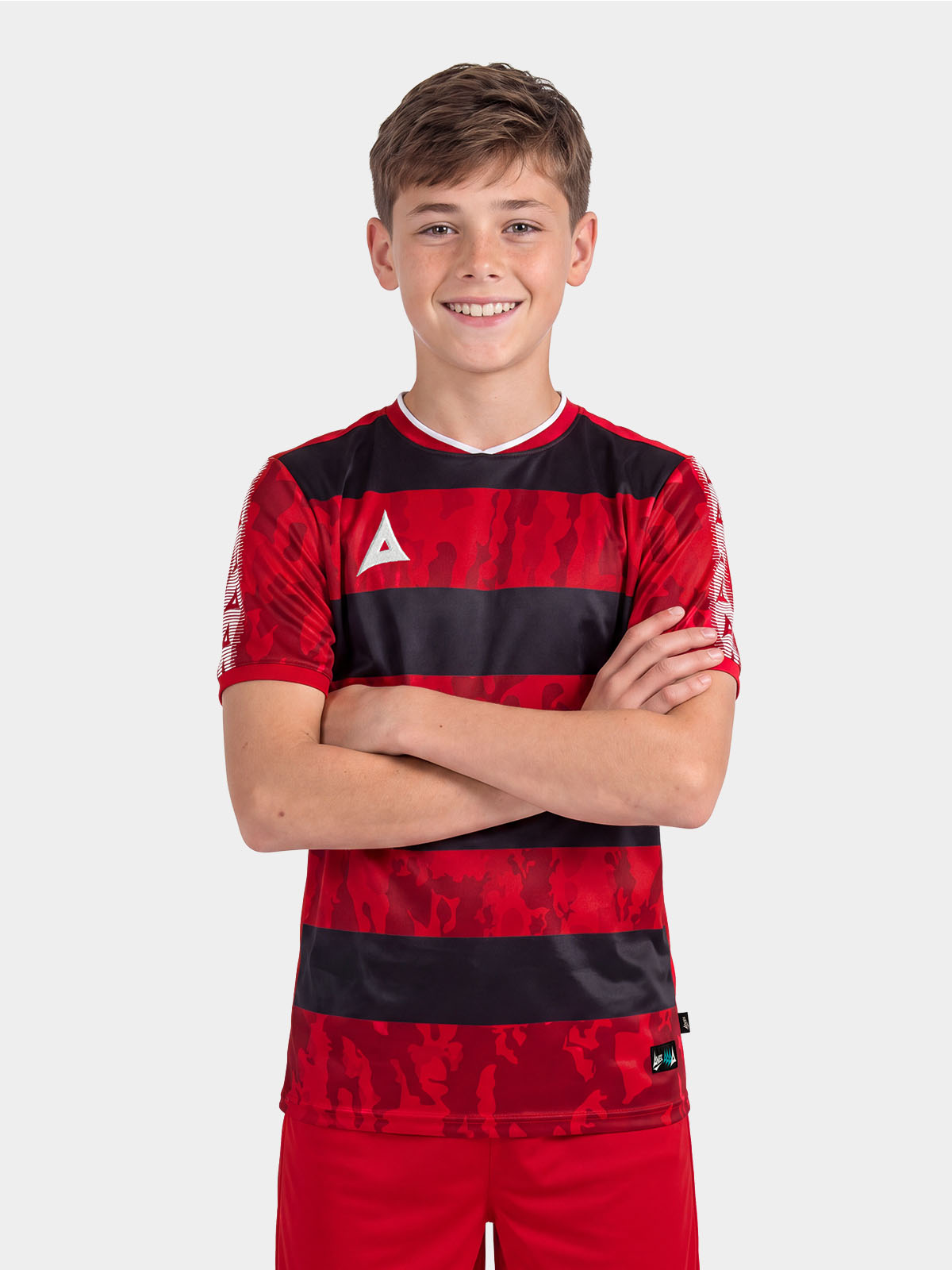 	portrait view of a model wearing the red and black pro intent jersey, showcasing the high quality athletic kit.